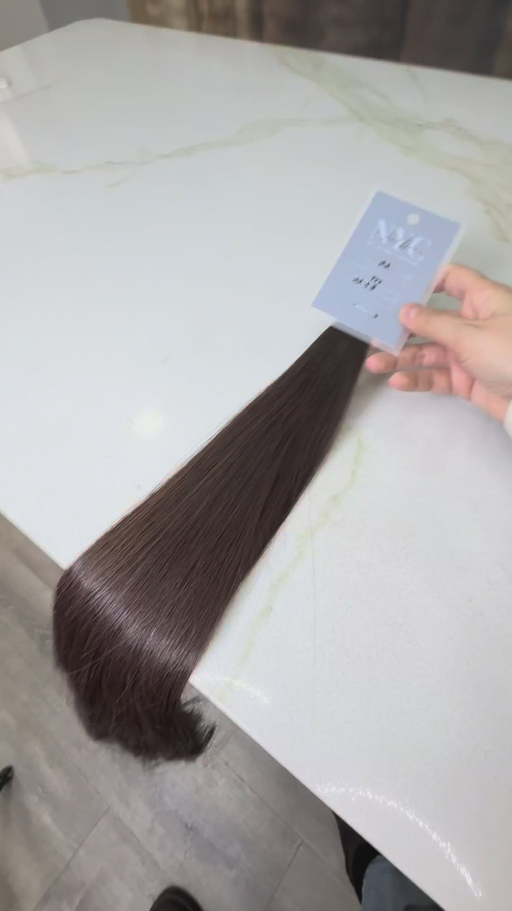 Russian Slavic bulk hair texture detail -  wavy pattern, brown color color, single donor ponytail