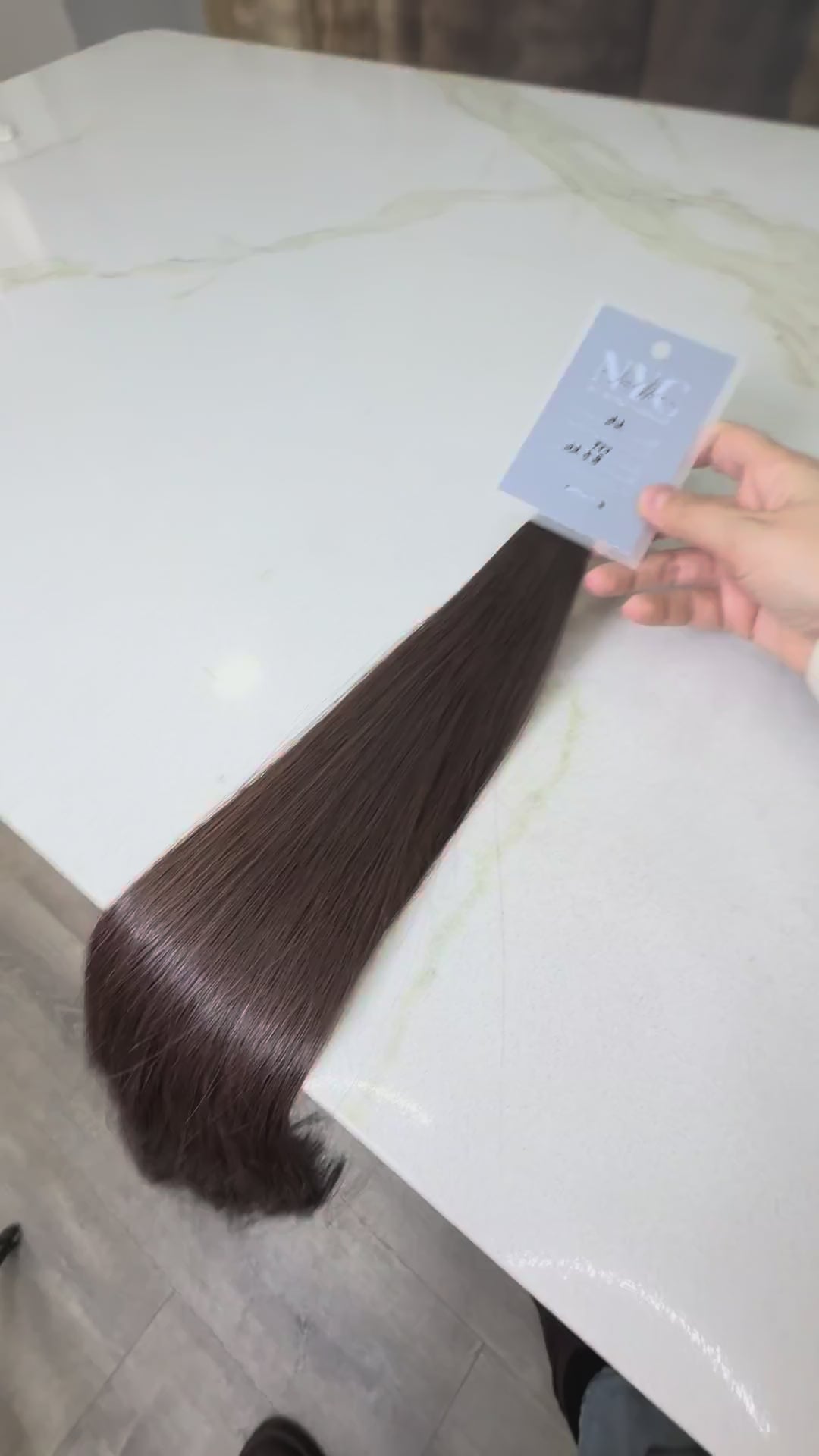 Russian Slavic bulk hair texture detail -  wavy pattern, brown color color, single donor ponytail