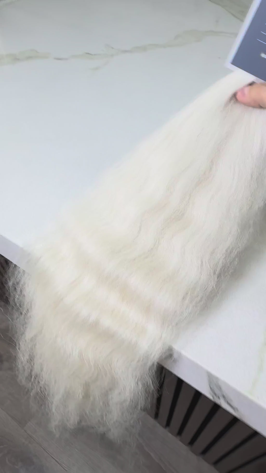 Russian Slavic bulk hair ponytail video - 24" cold blonde wavy texture movement and shine demonstration