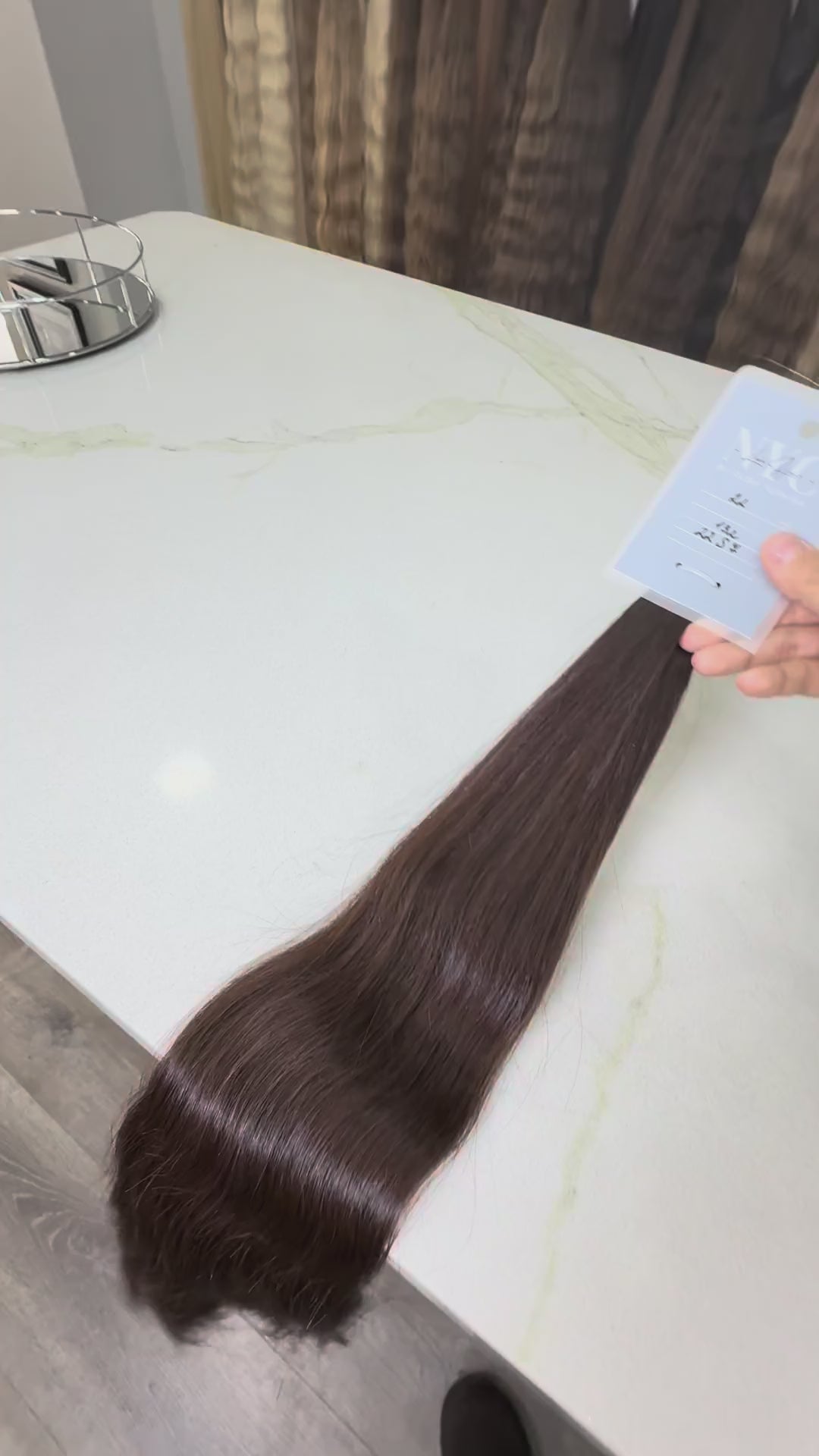 Russian Slavic bulk hair texture detail -  wavy pattern, brown color color, single donor ponytail